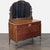 This antique wooden dresser features a large decorative mirror and four spacious drawers with vintage hardware. The...