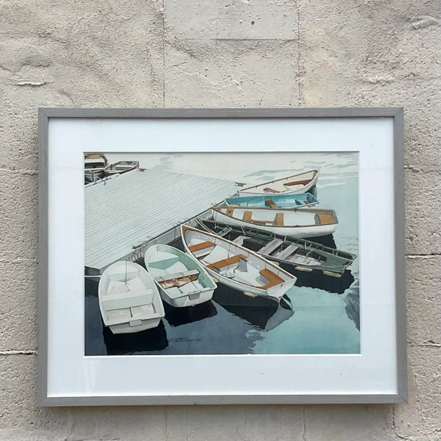 A fantastic vintage watercolor painting framed of dinghy’s tied up at a dock by artist Robert W. Bragg. Acquired at a Palm...