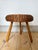 Vintage wicker tripod stool / side table in the manner of Tony Paul, 1960s Woven wicker circular seat on beech legs. The...