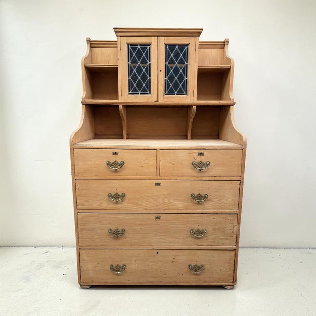 This charming mid to late 1800s pine dresser embodies the warmth and simplicity of classic English countryside interiors....
