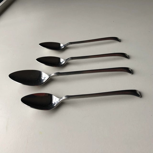 Midcentury rare and high quality , heavy set of 3 stainless steel Tea Spoons 6.25"L , 1 Table Spoon 7.75"L makers mark...