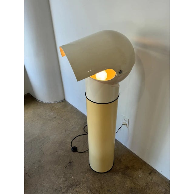 Pileo Floor Lamp Designed by Gae Aulenti for Artemide, 1970's. Made entirely of ABS plastic; the lampshade can be moved up...