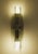 Pair of sculptural Italian glass wall sconces with faceted smoked grey fume glass. An elegant pair of vintage Italian...