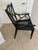 A vintage Chinese Chippendale style black faux bamboo armchair from the mid 20th century. Made in the USA during the...