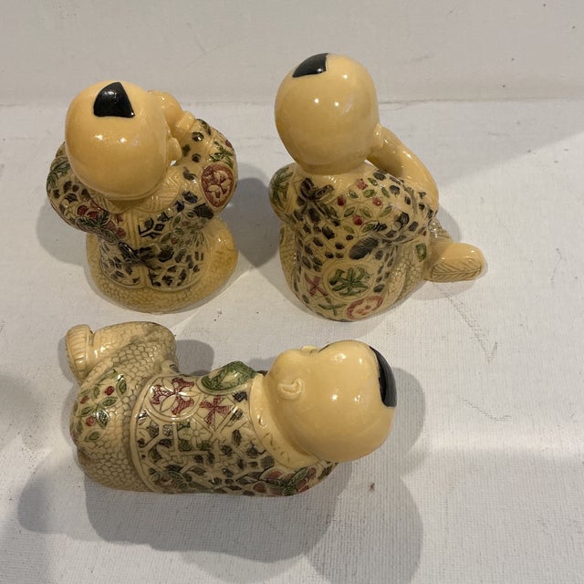 Vintage mid century resin Hotei Buddha figurines They have colored engraved scrimshaw designs. Happy Hotei or Budai is a...