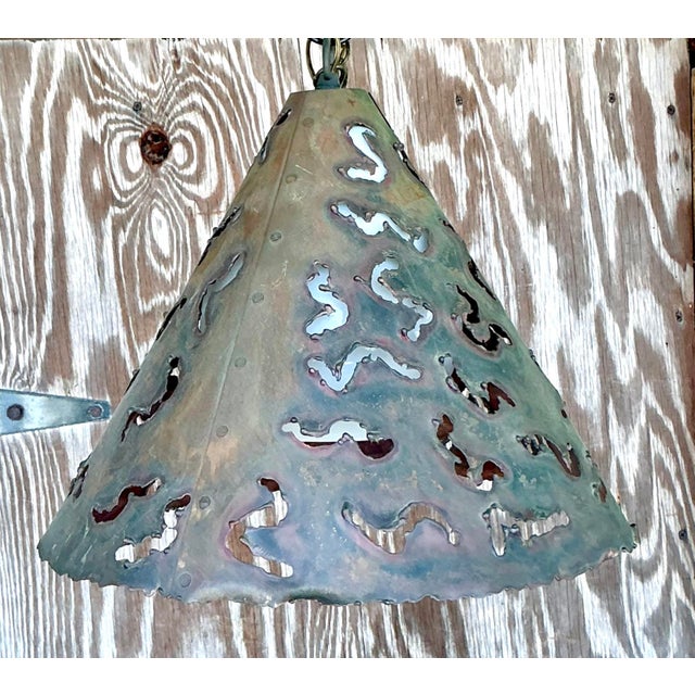 Elevate your space with this captivating vintage cone pendant light, a true statement piece that seamlessly blends Boho...