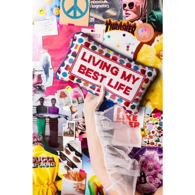 "Living My Best Life" printed text decorative needlepoint pillow. Geometric colorful polka dot background and a blue...