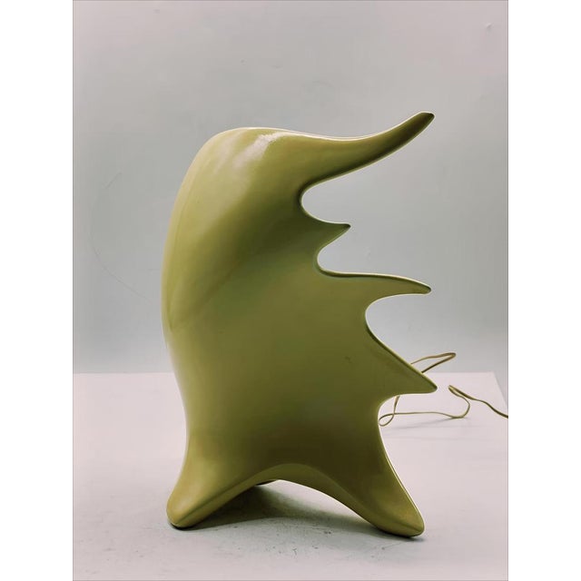 A rare straw-yellow glazed ceramic table lamp, the original ‘Conchiglia’ model from the 1950s, designed by Antonia Campi...