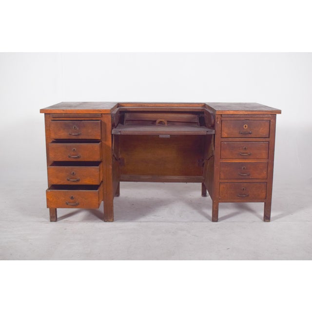 Mid-20th century Portuguese desk with a tilting top. Its functional design is typical of the 1930s to 1950s. The piece...