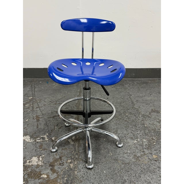 Design Plus Gallery presents a Contemporary Blue Tractor Seat Adjustable Drafting Stool from Flash Furniture. This...
