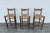 Beautiful vintage set of three Danish Modern style bar stools, circa 1970s, crafted with solid wood frames and handwoven...