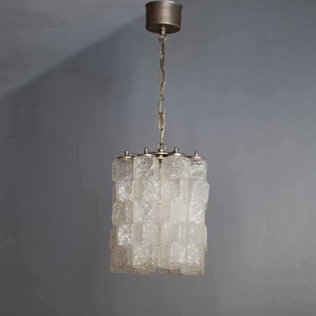A 1970s Murano glass chandelier. Made in Italy by ZeroQuattro. In good overall condition, with signs of wear and oxidation...