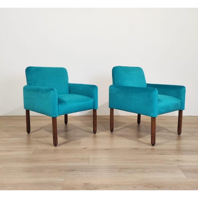 Pair of model 896 armchairs designed by Vico Magistretti in 1963 for Cassina. The wooden frames of the armchairs are...