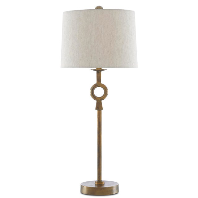 The Germaine Table Lamp has a cleverly placed circlet on its stem-like body made of aluminum in an antique brass finish. A...