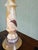 A unique hand-turned spiral-carved onyx candlestick , displaying warm amber, cream, and honey banding of natural stone....
