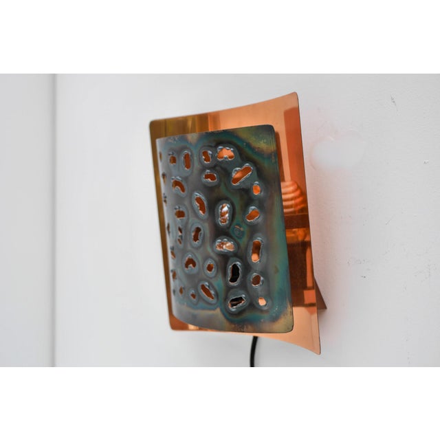 A striking Brutalist wall sconce by Boréns, Sweden, circa 1970s. Thia sculptural sconce beautifully embody the bold...