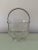 A vintage diamond-cut glass ice bucket with a silver-plated/stainless handle. Excellent vintage condition. Stainless tongs...