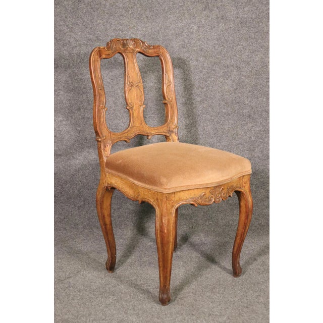 This is a period 1770s era Italian chair with pinned mortice and tennoned joinery and beautiful carving. The chair...