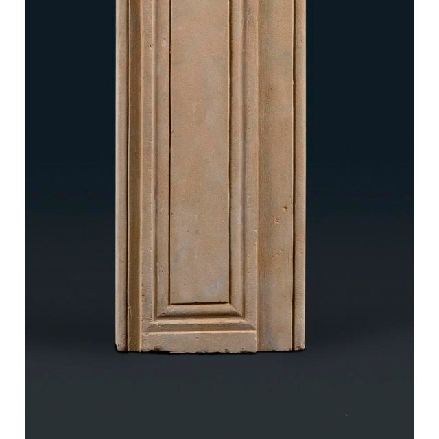 A large and dignified early eighteenth-century Queen Anne or George I stone frame fireplace surround, the shallow shelf...