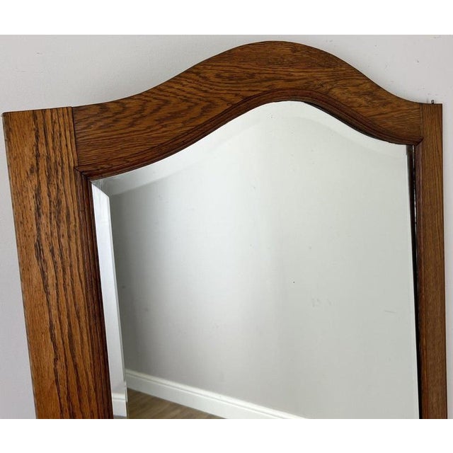 Enhance your home with this Antique French mirror, beautifully crafted in oak and originally part of a French wardrobe....