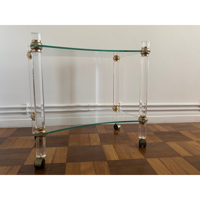 Built from clear acrylic and glass, it embodies one of the central ambitions of late modern design: to make furniture...