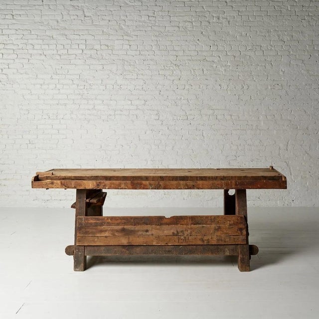 A phenomenally characterful 19th century French carpenter's workbench, crafted from solid oak and pine and bearing every...