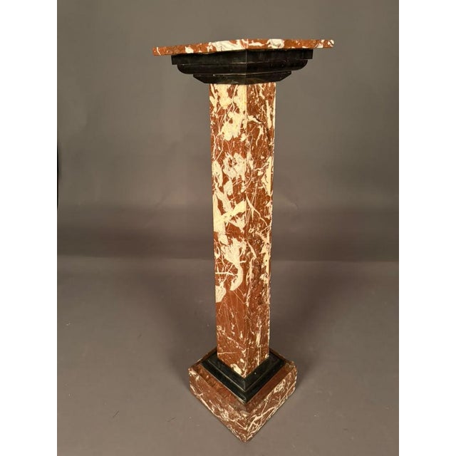 19th-century French marble pedestal dating to circa 1870, crafted in richly colored brown marble with contrasting black...
