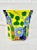 Colorful vintage planter. Made in Mexico. Features blue flowers with a colorful background. Has a hole for drainage....