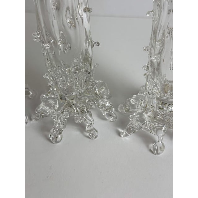 A visually arresting set of four handblown clear crystal thorn vases, produced in Czechoslovakia circa 1890, during the...