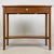 A charming and practical vintage 20th-century side table, well constructed in beech and combining understated design with...