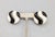1980s round goldtone black and white striped pierced with clip to keep them in place earrings. Marked "LES BERNARD" on one...