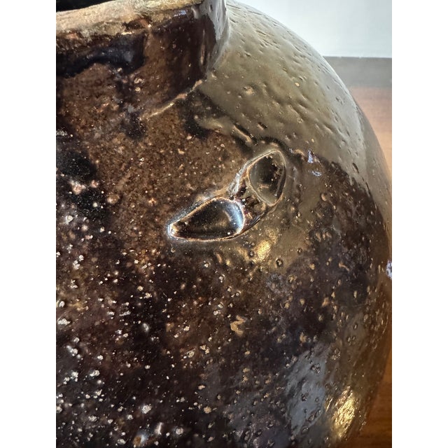 Antique Chinese Brown Martaban 16" Ceramic Storage Jar. Rough hewn and with one very old loss as shown. Rough edge to...