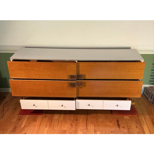 High-end 72” wide Mid-Century design Italian dresser with six drawers. Features sculpted nickel-plated metal handles and...