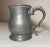 Up for sale is a rare antique 18th century handmade pewter beer mug. This circular footed mug is made out of thick pewter...