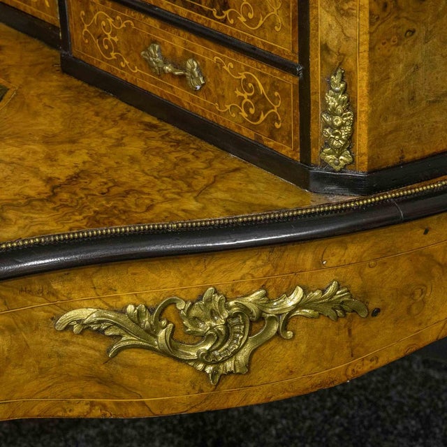 A very attractive Mid Victorian burr walnut writing desk (Bonheur De Jour) with ormolu mounts throughout. The serpentine...