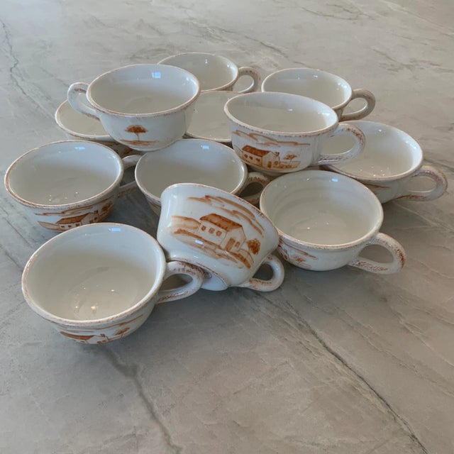 Pick up one of these hand-painted Vietri Bramasole flat coffee cups and step into the Italian countryside. The warm white...