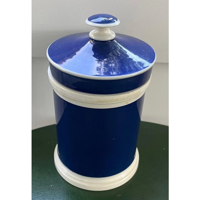 Antique 19th century French pottery apothecary jar and lid in a bright blue glaze. Measures 7" tall x 4" diameter. Good...