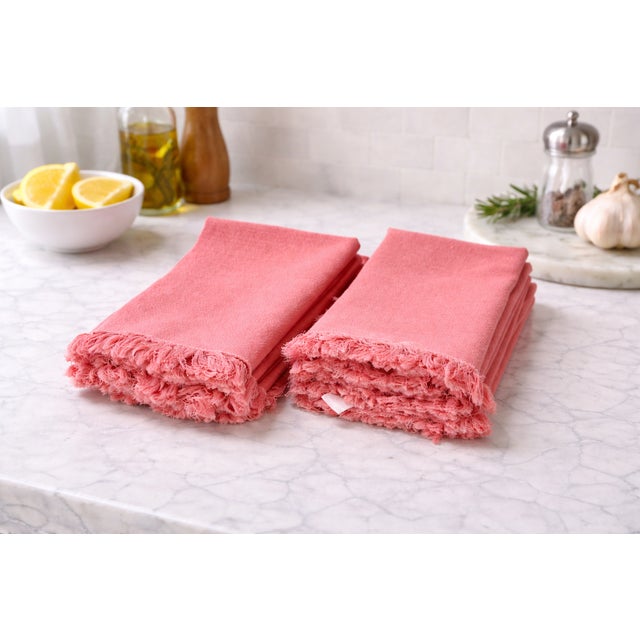 Set of 10 coral pink fringe dinner napkins by Vanson, crafted from 100% Egyptian cotton with a soft, substantial hand and...