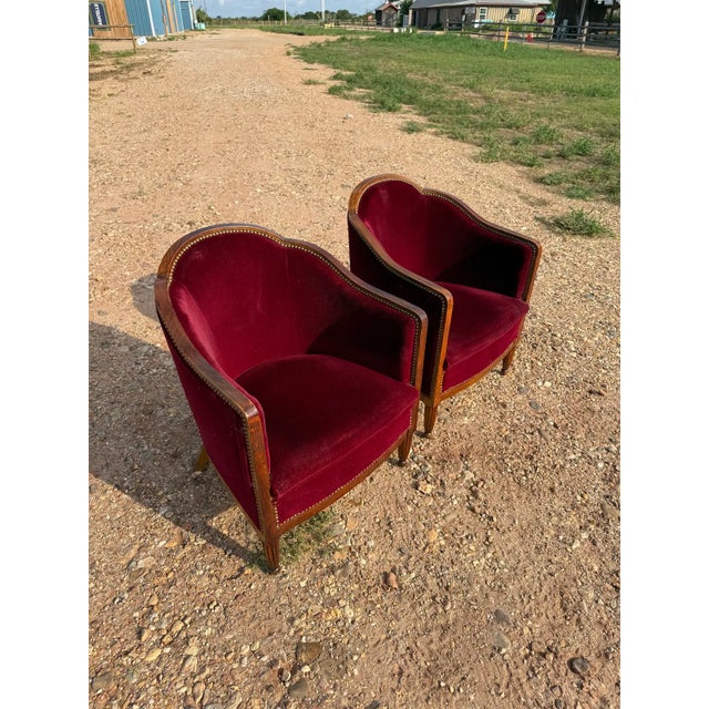 Classic pair of French Art Deco Solid Walnut Barrel Back Club Chairs. The wood has been finished with a lustrous French...