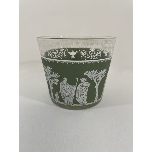 A charming Mid Century Modern Hellenic Classical Glass Ice Bucket, circa 1950s, made by the Jeannette Glass Company...