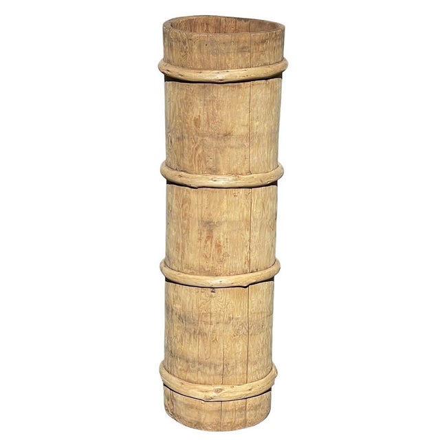 These vintage grain collection bins were once used by farmers throughout China to collect and store grains. Repurposed now...