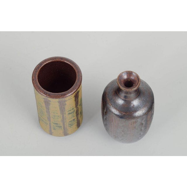 Two unique miniature vases, 1960/70s. Two hand-thrown miniature vases in stoneware with experimental glazes in brown,...
