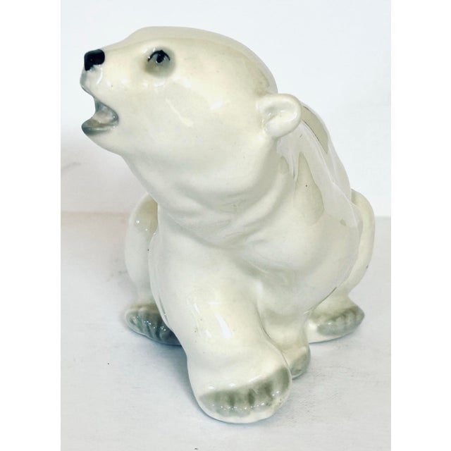 This charming figurine is a vintage Lomonosov porcelain polar bear, likely a cub, crafted by the Imperial Porcelain...