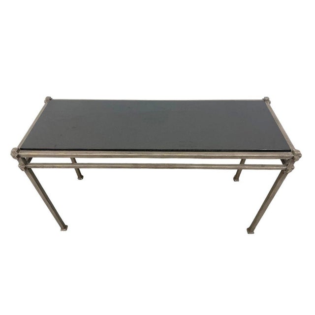 A striking pair of iron frame console tables, designed in a bold industrial-modern style. The sturdy, linear rectangular...