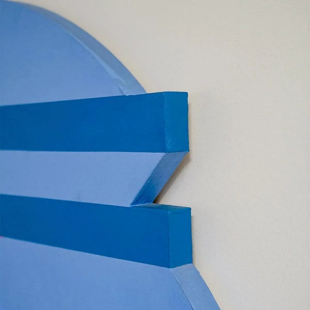 An acrylic painting on a shaped circular canvas. "It's solid, intelligent, sometimes playful," and manages to "convey...