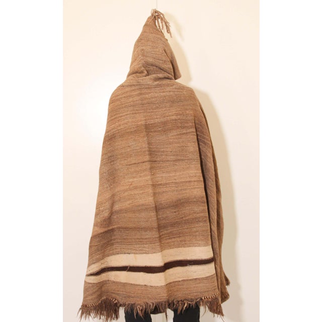 Moroccan Akhnif Berber hooded burnous cape in handwoven brown wool.Tribal traditional cape with hood handwoven in the High...