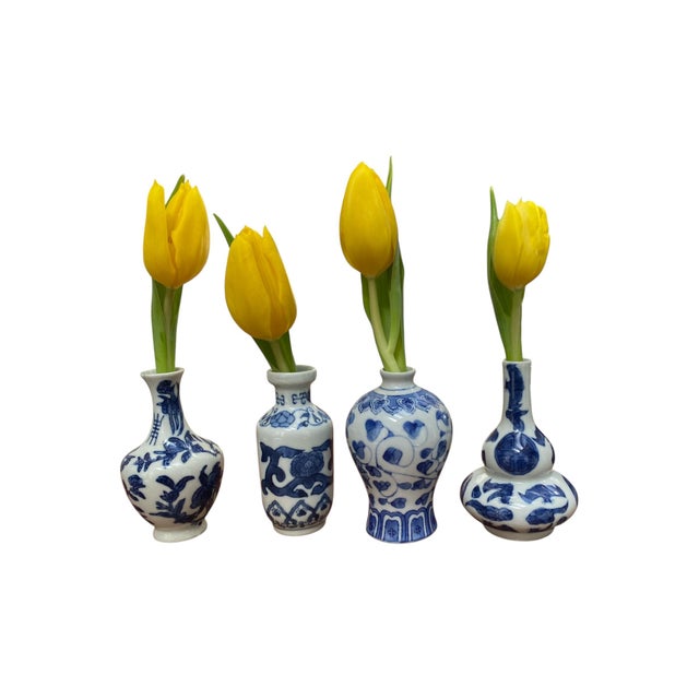 Set of 4 blue and white ceramic Chinese vases in miniature. Makers mark in Chinese and English on the bottom of each....