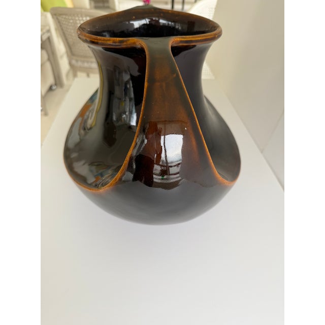This is a vintage ceramic dark brown high gloss Art Nouveau style vase. Beautiful form. Lighter brown highlights. Double...