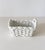 Rectangular shaped woven ceramic basket with handles in a glossy white glaze. Incised "MADE IN ITALY" on base....