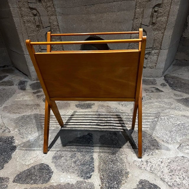For your consideration, a sculptural folding wooden magazine rack. It features clean, geometric lines heavily influenced...